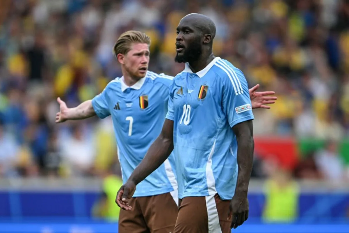Belgium's forward #10 Romelu Lukaku and midfielder #07 Kevin de Bruyne react during the UEFA Euro 2024 Group E football match between Ukraine and Belgium at the Stuttgart Arena in Stuttgart on June 26, 2024.  Fabrice COFFRINI / AFP