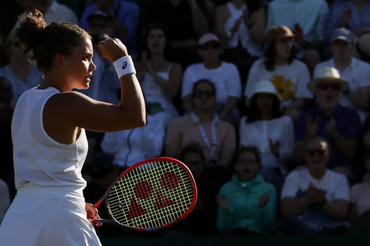 Italy's Jasmine Paolini reacts as she plays against Russia's Kamilla Rakhimova during their women's singles second round tennis match on the third day of the 2025 Wimbledon Championships at The All England Lawn Tennis and Croquet Club in Wimbledon, southwest London, on July 2, 2025.  Adrian Dennis / AFP