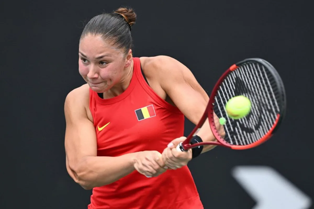 Belgium's Sofia Costoulas hits a return to China's Wang Xiyu during their women's singles match at the Billie Jean King Cup tennis play-offs at the Guangzhou Nansha International Tennis Center in Guangzhou, in south China's Guangdong province on November 17, 2024.  STR / AFP