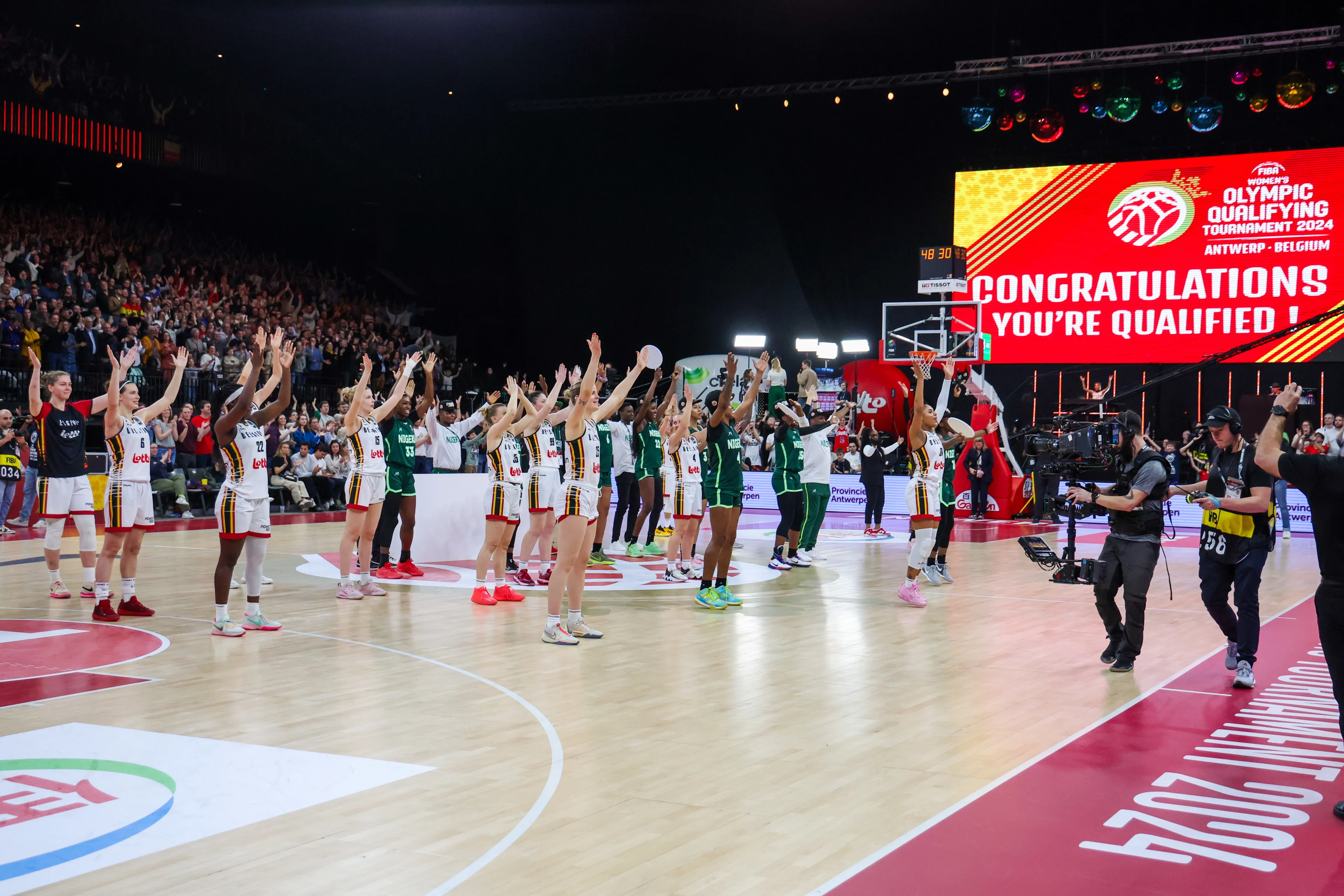 Belgian Cats' players celebrate after winning a basketball match between Belgian national women team 'the Belgian Cats' and Nigeria, Sunday 11 February 2024 in Antwerp, during the FIBA Women's basketball qualification tournament for the 2024 Summer Olympics in Paris, France. BELGA PHOTO VIRGINIE LEFOUR