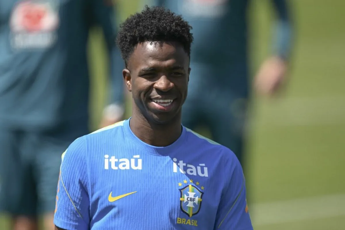 Brazil's forward Vinicius Junior smiles on during a training session as part of the team's preparation for its FIFA World Cup football tournament opening match against Morocco at Columbia Park Training Facility in Morristown, New Jersey on June 9, 2026. MAURO PIMENTEL / AFP