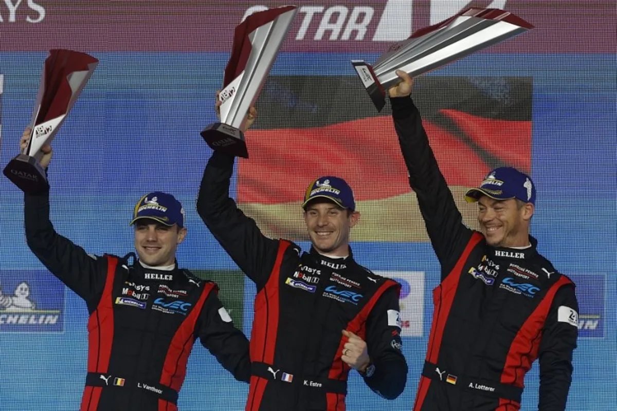 (L-R) First placed Porsche Penske Motorsport Belgium's Laurens Vanthoor, France's Kevin Estre and Germany's Andre Lotterer celebrate with their trophies after winning the Hypercar race at the season-opener of FIA World Endurance Championship 2024 at the Lusail International Circuit in Lusail, north of Doha on March 2, 2024.  KARIM JAAFAR / AFP