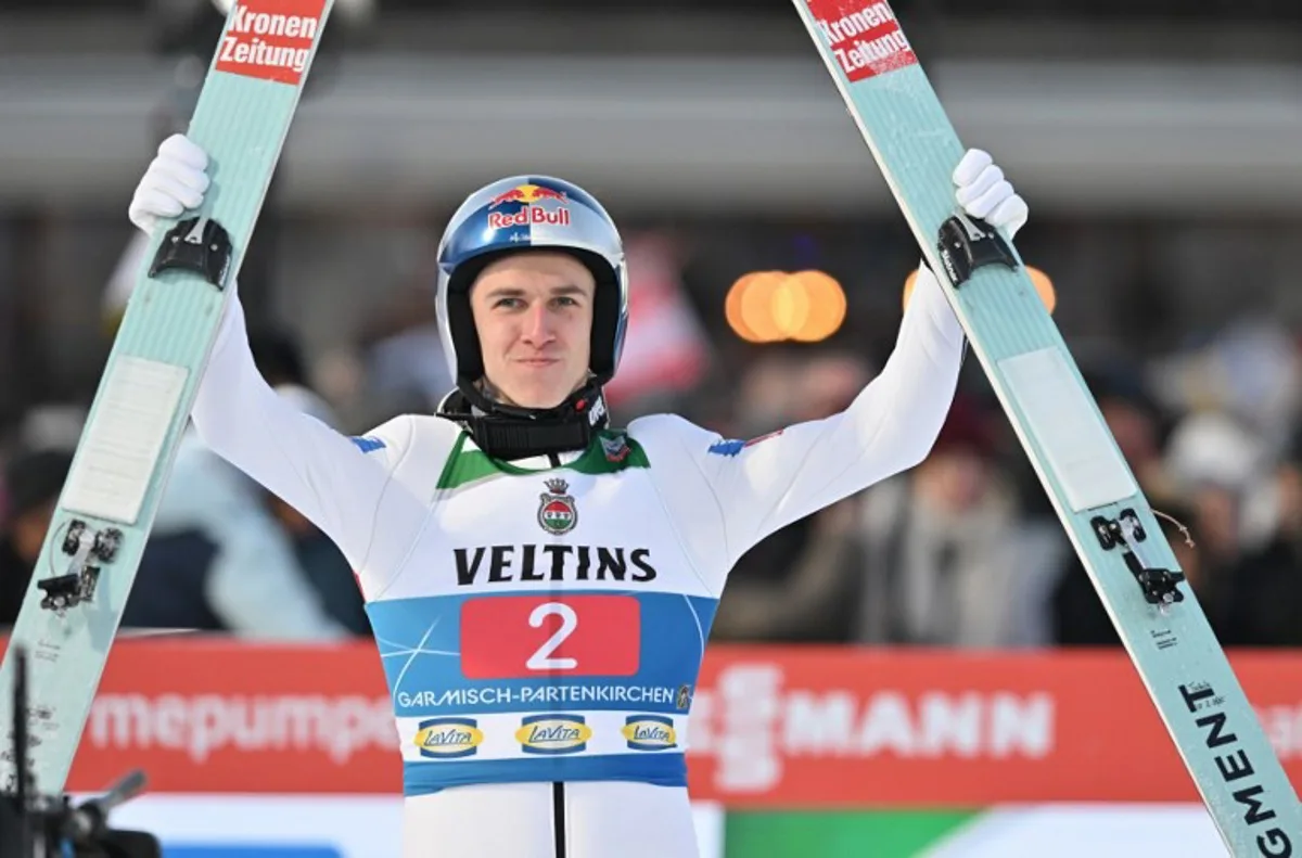 Austria's Daniel Tschofenig reacts after his second jump during the competition at the second leg of the Four Hills Ski Jumping tournament (Vierschanzentournee), in Garmisch-Partenkirchen, southern Germany, on January 1, 2025.  KERSTIN JOENSSON / AFP