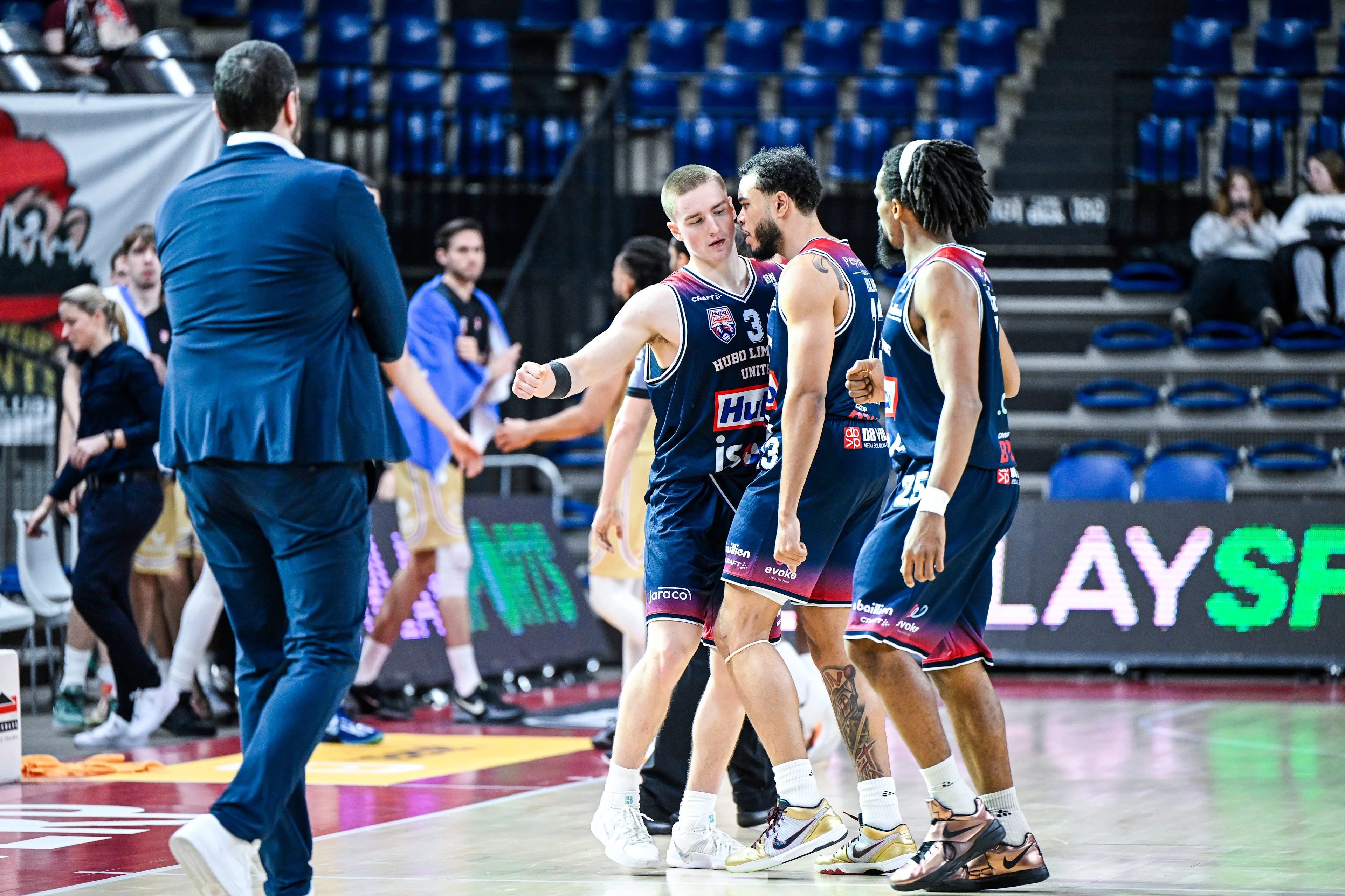 Limburg's Jo Van Buggenhout and Limburg's Jaren Holmes celebrate after winning a basketball match between Antwerp Giants and Limburg United, Wednesday 22 January 2025 in Antwerp, on day 18 of the 'BNXT League' first division basket championship. BELGA PHOTO TOM GOYVAERTS