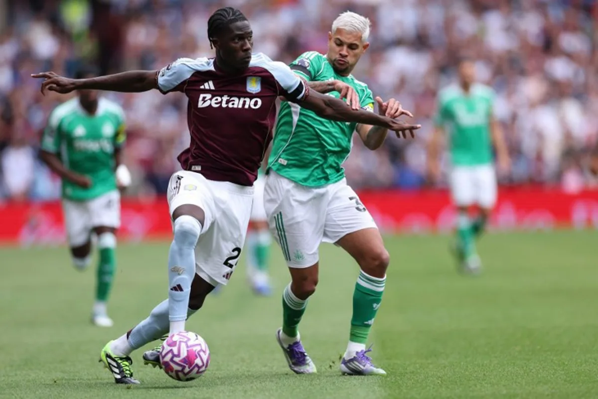 Aston Villa's Belgian defender #24 Amadou Onana (L) vies with Newcastle United's Brazilian midfielder #39 Bruno Guimaraes (R) during the English Premier League football match between Aston Villa and Newcastle United at Villa Park in Birmingham, central England on August 16, 2025. Adrian Dennis / AFP