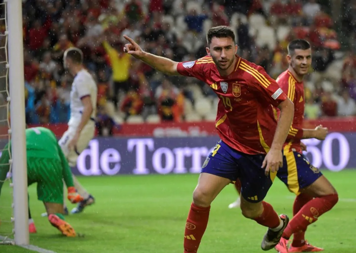 Spain's defender #14 Aymeric Laporte celebrates scoring his team's first goal during the UEFA Nations League, league A group 4 football match between Spain and Serbia at the Nuevo Arcangel stadium in Cordoba, on October 15, 2024.  CRISTINA QUICLER / AFP