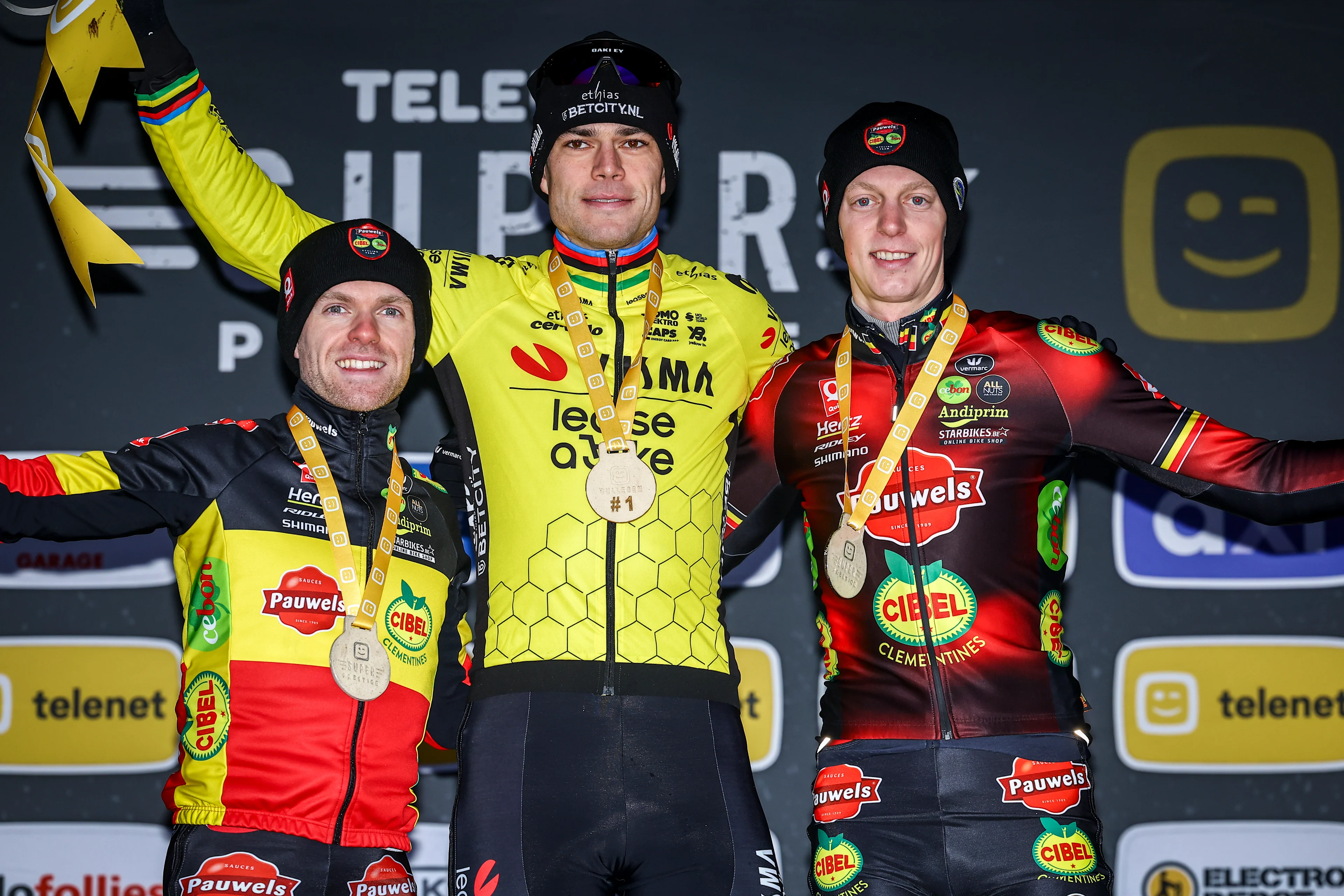 Belgian Eli Iserbyt, Belgian Wout van Aert and Belgian Michael Vanthourenhout pictured on the podium after the men elite race at the cyclocross cycling event in Gullegem on Saturday 04 January 2025, stage 7/8 in the Superprestige cyclocross cycling competition BELGA PHOTO DAVID PINTENS