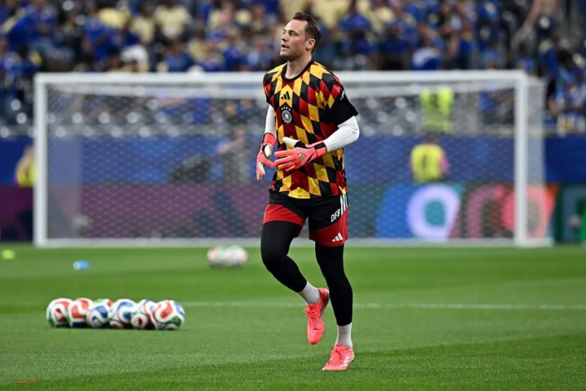 Germany's goalkeeper #01 Manuel Neuer takes part in the warm-up ahead of the 2026 World Cup Group E football match between Germany and Curacao at the Houston Stadium in Houston on June 14, 2026.    Paul ELLIS / AFP
