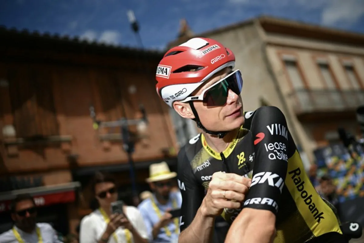 Team Visma - Lease a bike team's Danish rider Jonas Vingegaard looks on as he awaits the start of the 15th stage of the 112th edition of the Tour de France cycling race, 169.3 km between Muret and Carcassonne, southwestern France, on July 20, 2025. Loic VENANCE / AFP