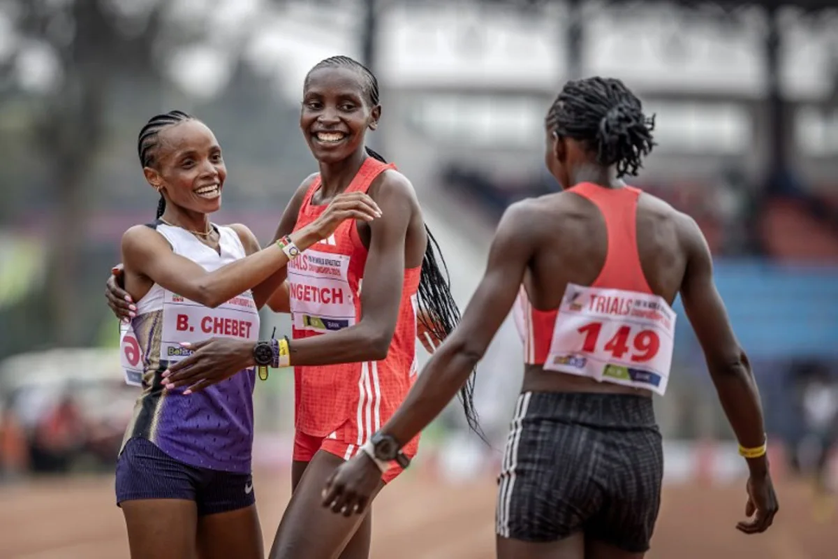 Kenya's Olympic gold medallist and world record holder Beatrice Chebet (L), Kenya's Agnes Jebet Ngetich (C) and Kenya's Janeth Chepngetich (R) celebrate after qualifying in the women's 10000m event of the Kenya trials for Tokyo 2025 world championships at the Ulinzi Sport Complex in Nairobi on July 22, 2025. Luis TATO / AFP
