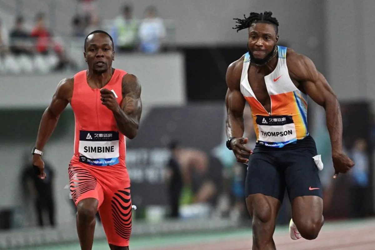 South Africa's Akani Simbine (L) and Jamaica's Kishane Thompson (R) compete in men's 100m during the Shanghai/Keqiao Diamond League athletics meeting in Keqiao, Shaoxing, in China's eastern Zhejiang province, on May 3, 2025. Pedro PARDO / AFP