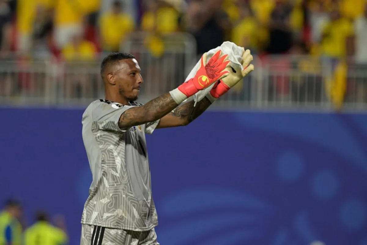 Curacao's goalkeeper #01 Eloy Room celebrates at the end of the 2026 World Cup Group E football match between Ecuador and Curacao at the Kansas City Stadium in Kansas City on June 20, 2026.   JUAN MABROMATA / AFP