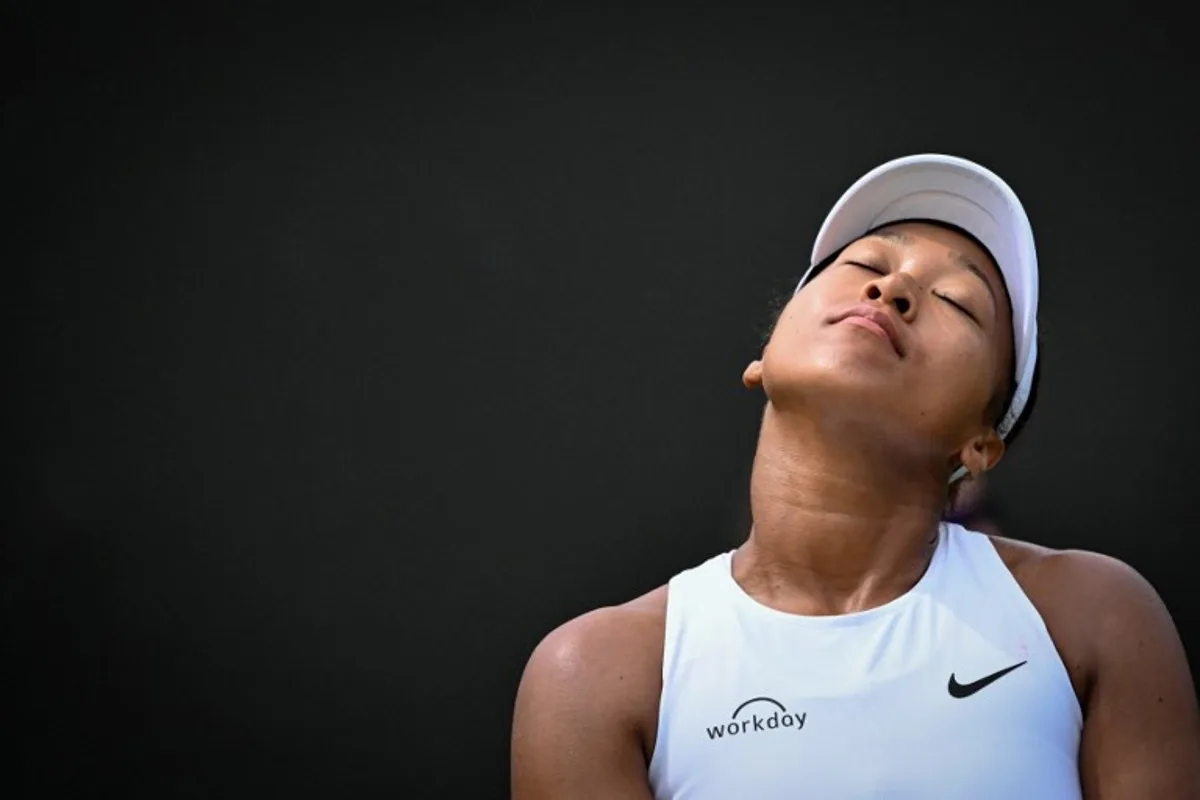 Japan's Naomi Osaka reacts as she plays against Russia's Anastasia Pavlyuchenkova during their women's singles third round tennis match on the fifth day of the 2025 Wimbledon Championships at The All England Lawn Tennis and Croquet Club in Wimbledon, southwest London, on July 4, 2025. Kirill KUDRYAVTSEV / AFP