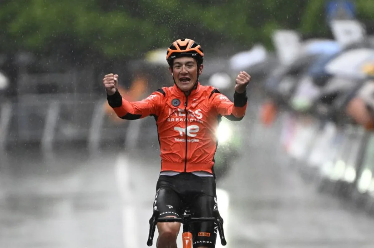 Team Ineos' US rider AJ August celebrates winning the sixth and last stage of the Basque Country's Itzulia cycling tour, a 135.4 km race between Goizper-Antzuola and Bergara, on April 11, 2026. ANDER GILLENEA / AFP