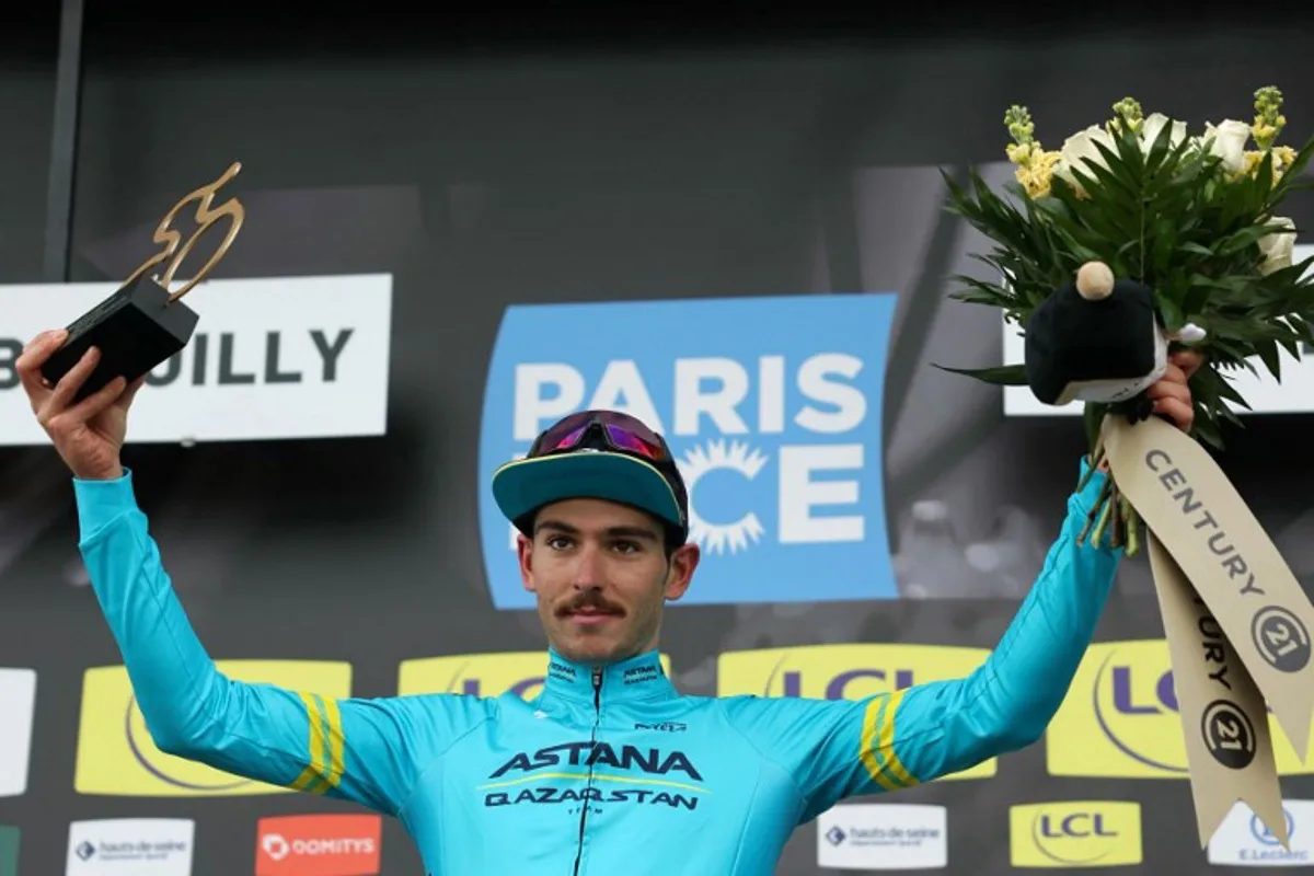 Astana Qazaqstan Team's Italian cyclist Christian Scaroni celebrates his combativity award on the podium after the 4th stage of the Paris-Nice cycling race, 183 km between Chalon-sur-Saone and Mont Brouilly, on March 6, 2024.  Thomas SAMSON / AFP