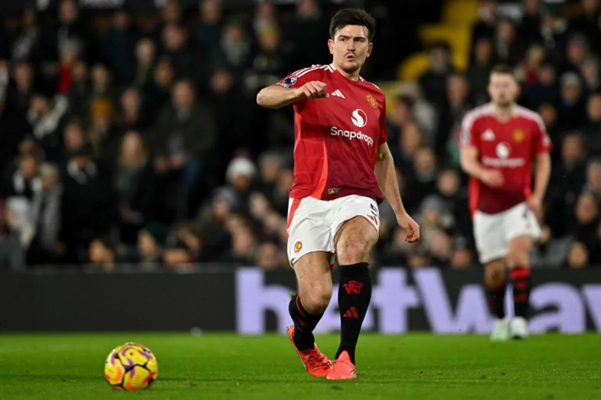 Manchester United's English defender #05 Harry Maguire passes the ball during the English Premier League football match between Fulham and Manchester United at Craven Cottage in London on January 26, 2025.  Glyn KIRK / AFP