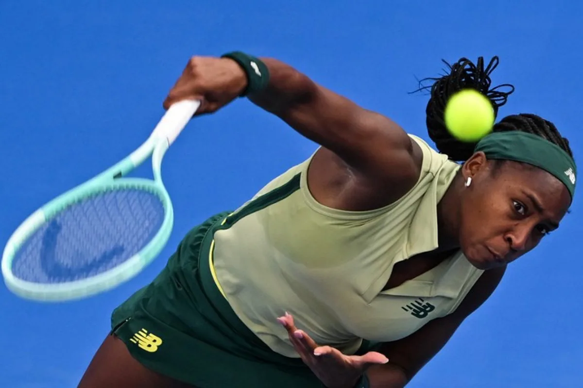 Coco Gauff of the USA serves the ball to Marta Kostyuk of the Ukraine during their 2025 WTA Qatar Open match at the Khalifa International Tennis Complex in Doha on February 11, 2025.  Mahmud HAMS / AFP