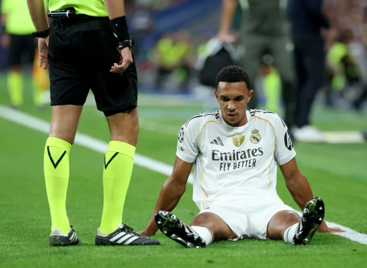 Real Madrid's English defender #12 Trent Alexander-Arnold reacts on the ground after suffering an injury during the UEFA Champions League first round day 1 football match between Real Madrid CF and Olympique de Marseille at the Santiago Bernabeu stadium in Madrid on September 16, 2025. Thomas COEX / AFP