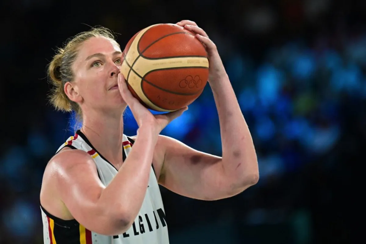 Belgium's #11 Emma Meesseman takes a free throw in the women's Bronze Medal basketball match between Belgium and Australia during the Paris 2024 Olympic Games at the Bercy  Arena in Paris on August 11, 2024.  Damien MEYER / AFP