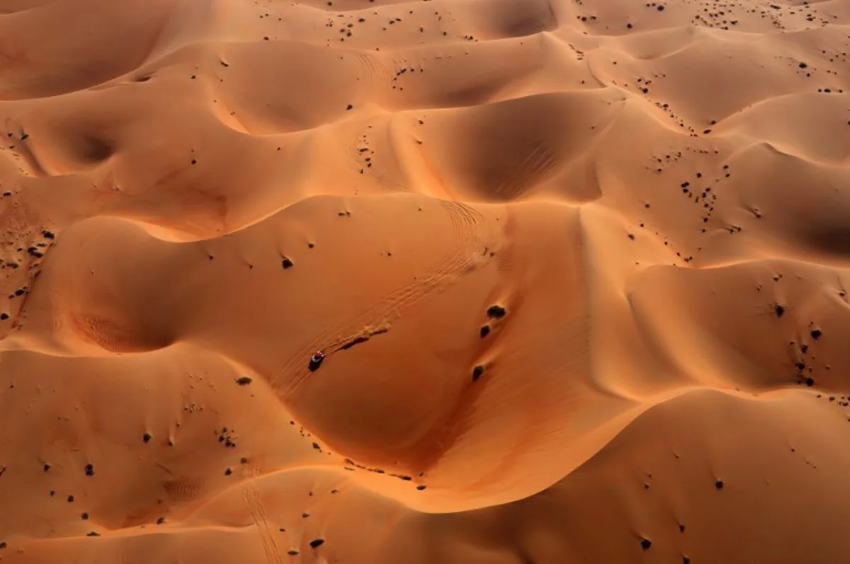 A driver competes during Stage 10 of the Dakar Rally 2025, between Haradh and Shubaytah, Saudi Arabia, on January 15, 2025.  Valery HACHE / AFP