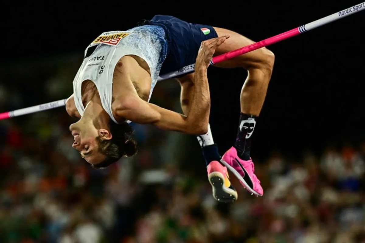 Italy's Gianmarco Tamberi competes in the men's high jump final during the European Athletics Championships at Alexander Stadium in Birmingham on August 14, 2026. Ben STANSALL / AFP