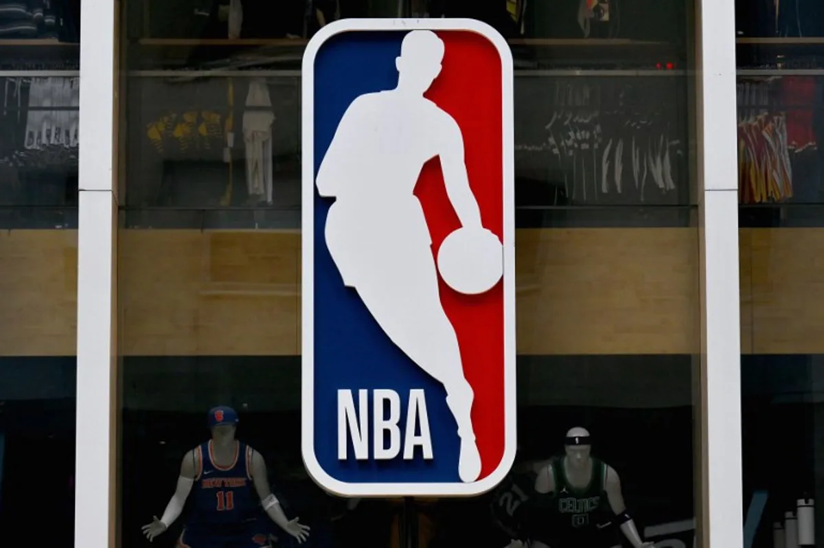 The NBA logo is seen outside an NBA fan store in New York on July 8, 2024.  ANGELA WEISS / AFP