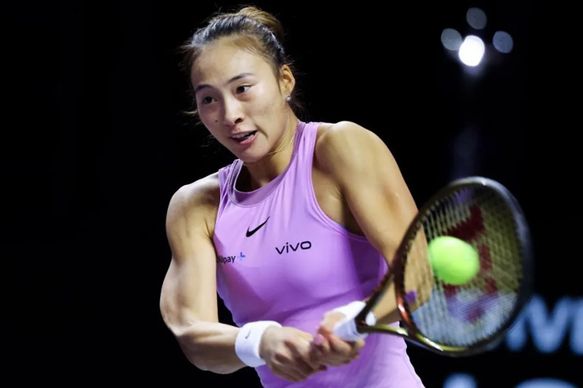 China's Zheng Qinwen hits a return against US' Coco Gauff during their women's singles final tennis match at the WTA Finals Championship in Riyadh on November 9, 2024.  Fayez NURELDINE / AFP