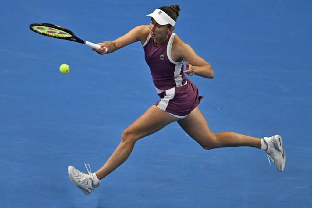 Belgium's Elise Mertens hits a return to China's Zheng Qinwen during their women's singles semi-final at the China Open tennis tournament in Beijing on October 10, 2026.  Pedro Pardo / AFP