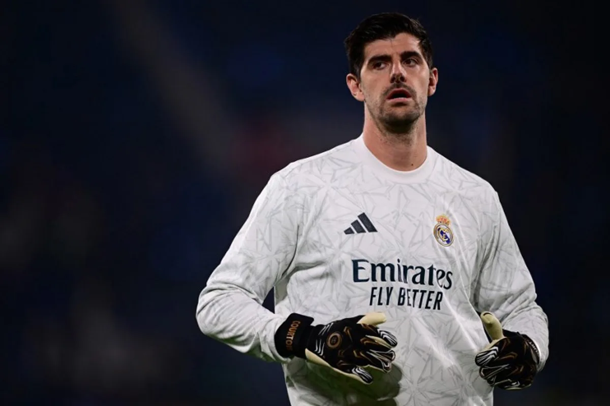 Real Madrid's Belgian goalkeeper #01 Thibaut Courtois warms up before the UEFA Champions League football match between Atalanta and Real Madrid at the Gewiss Stadium in Bergamo, on December 10, 2024.  Marco BERTORELLO / AFP