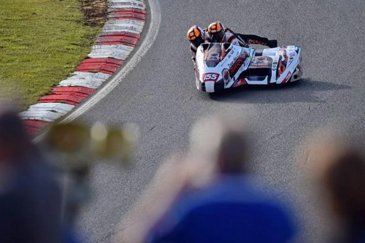 True Heroes Racing Team rider Michael Russell (R) during practice for the Molson Group British Sidecars race, part of the Bennetts British Superbike Championship weekend at Brands Hatch, south of London on June 14, 2019. John Footitt a veteran of the Falklands War diagnosed with Post Traumatic Stress Disorder admits sudden noises out of the blue still terrify him but in contrast, the ear-splitting cacophony of Super Bikes does not. True Heroes -- who compete in three categories including the awe-inspiring sidecar championship -- were set up in 2012 the brainchild of Royal Navy warrant officer Phil Spencer.  GLYN KIRK / AFP TO GO WITH AFP STORY BY PIRATE IRWIN

