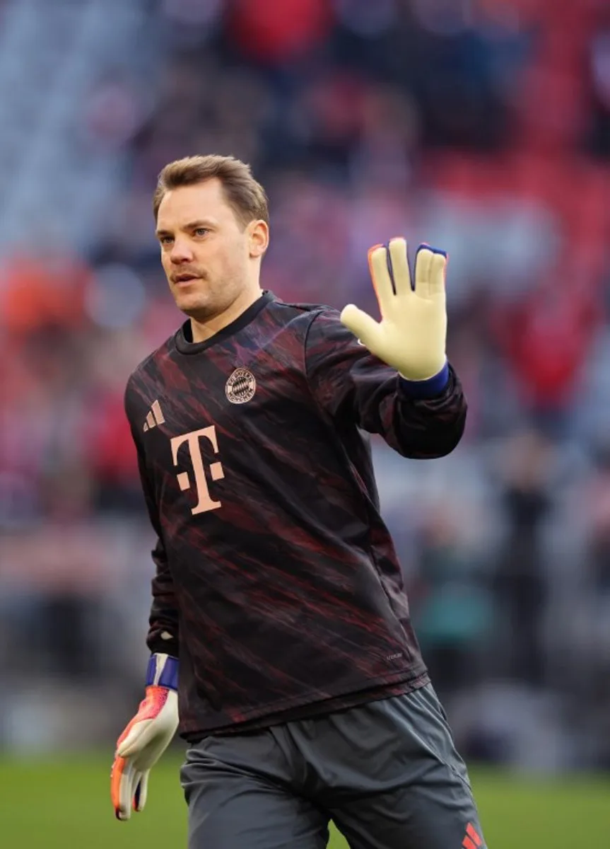 Bayern Munich's German goalkeeper #01 Manuel Neuer cheers to supporters before the German first division Bundesliga football match between FC Bayern Munich and FC St Pauli in Munich, southern Germany on November 29, 2025.  Alexandra BEIER / AFP