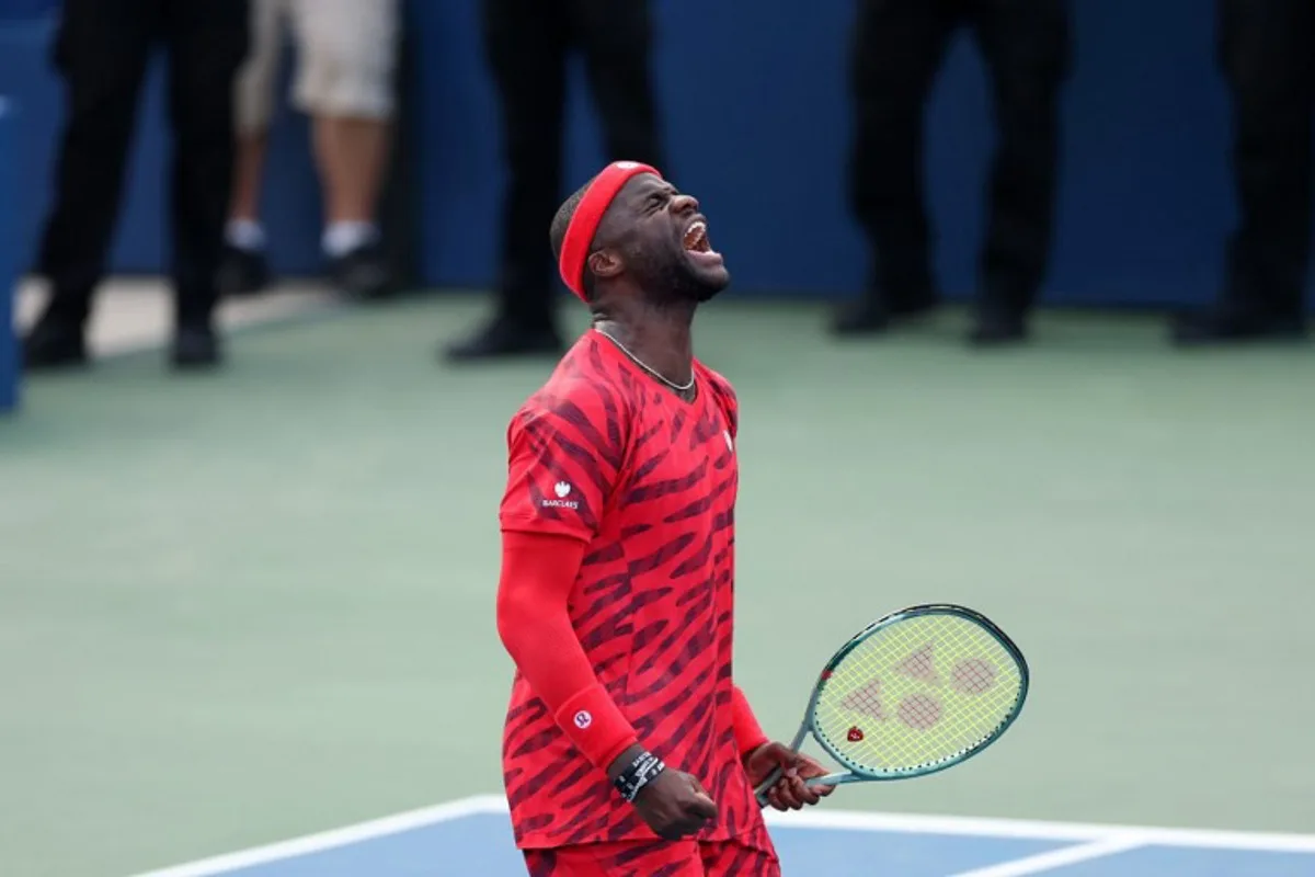 USA's Frances Tiafoe celebrates his victory over USA's Martin Damm Jr. during their men's singles second round tennis match on day four of the US Open tennis tournament at the USTA Billie Jean King National Tennis Center in New York City, on August 27, 2025. CHARLY TRIBALLEAU / AFP