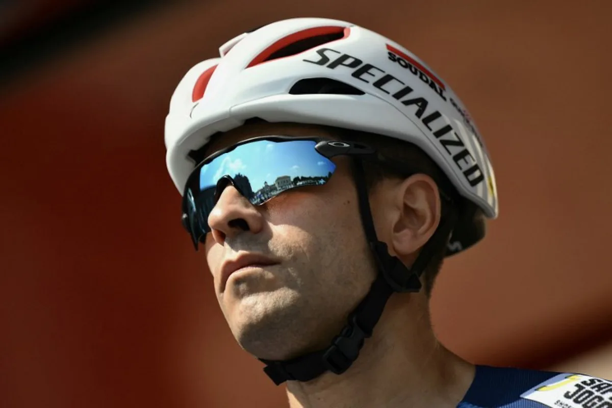 Soudal Quick-Step's Spanish rider Mikel Landa is presented on stage before the start of the Vuelta a Espana, a 183 km race between Torino - Reggia di Venaria and Novara, in Italy's Piemonte region, on August 23, 2025.    Marco BERTORELLO / AFP