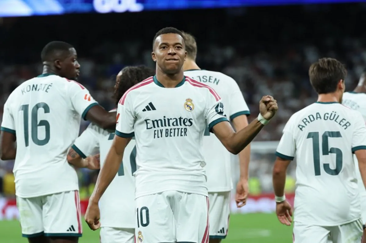 Real Madrid's French forward #10 Kylian Mbappe celebrates scoring his team's second goal during the Spanish league football match between Real Madrid CF and Real Sociedad  at Santiago Bernabeu Stadium in Madrid on August 26, 2026.  Thomas COEX / AFP
