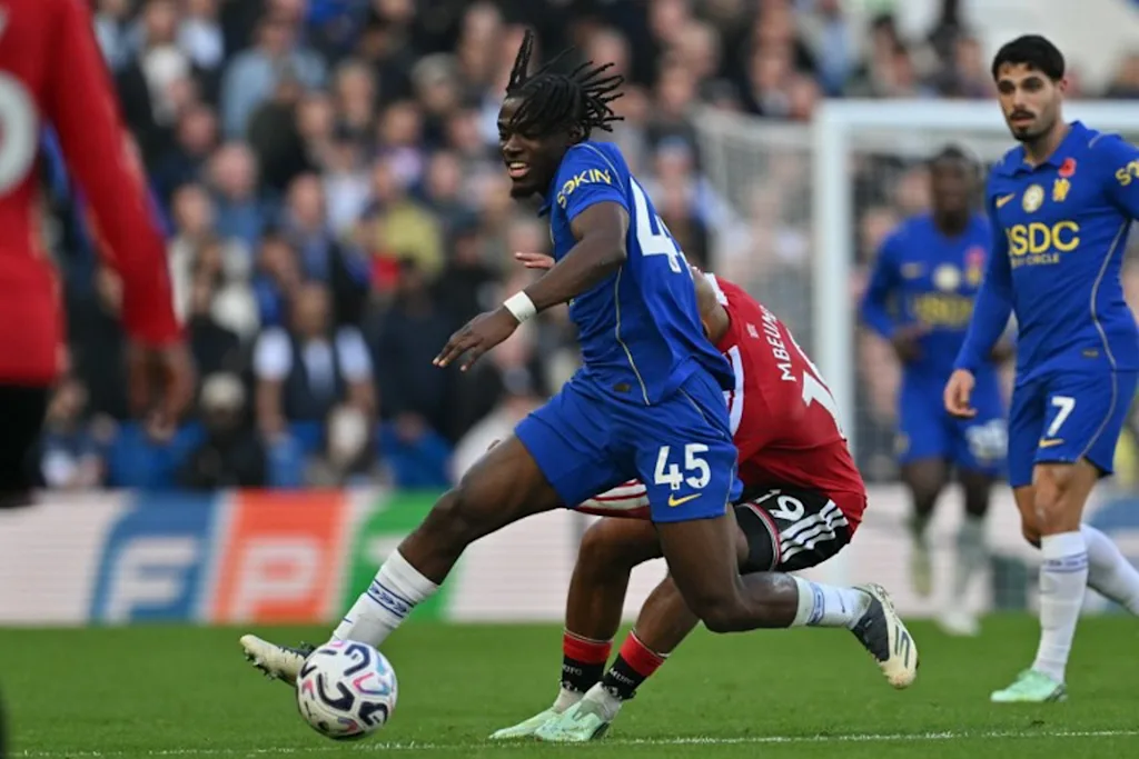Chelsea's Belgian midfielder #45 Romeo Lavia vies with Manchester United's Cameroonian midfielder #19 Bryan Mbeumo during the English Premier League football match between Chelsea and Manchester United at Stamford Bridge in London on October 31, 2026. Glyn KIRK / AFP