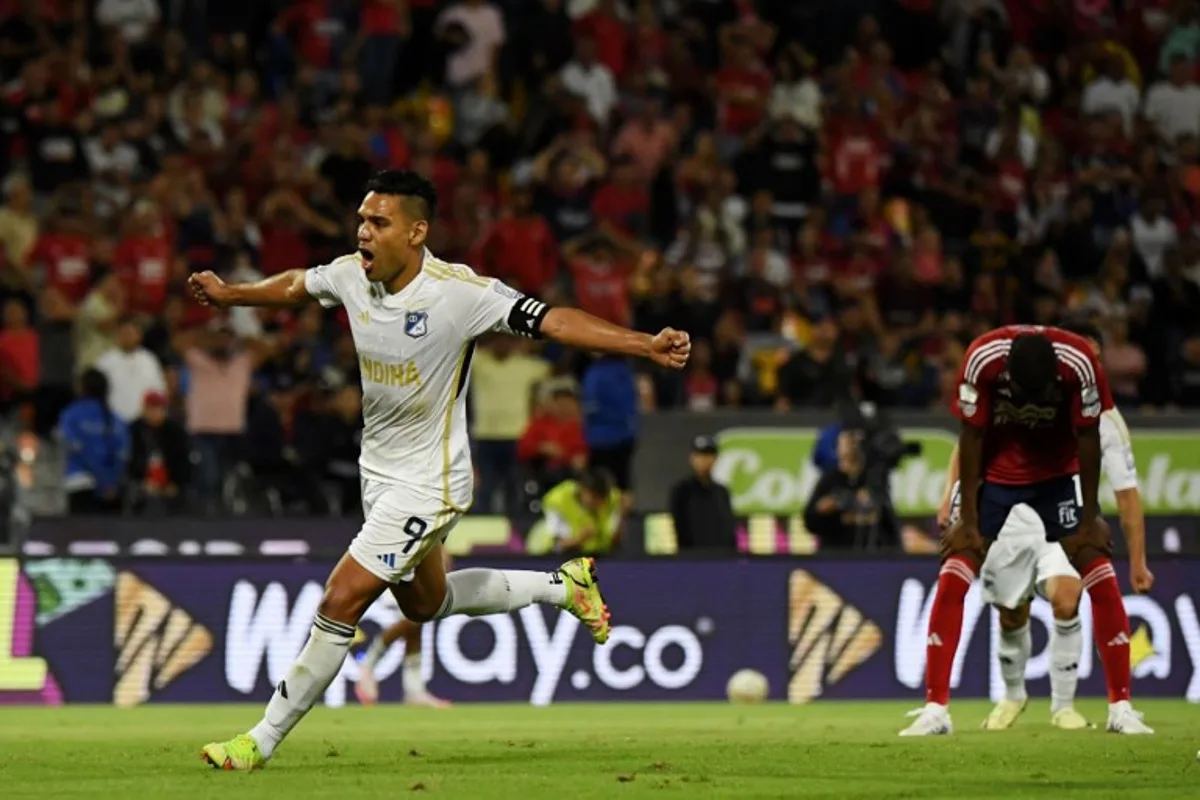 Millonarios' forward Radamel Falcao (L) celebrates his team's first goal scored by Millonarios' Argentine forward Santiago Giordana (unseen) during the Liga Betplay Dimayor II football league match between Independiente Medellin and Millonarios at Atanasio Girardot Stadium in Medellin, Colombia on July 18, 2024.  Jaime SALDARRIAGA / AFP