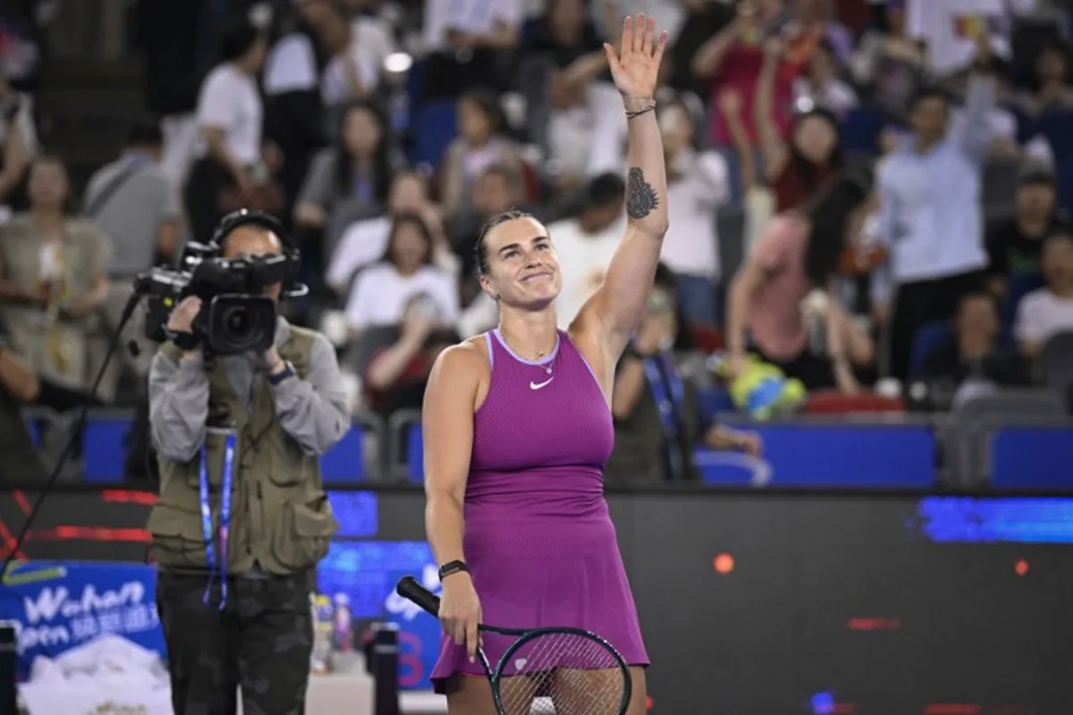 Belarus's Aryna Sabalenka celebrates after her victory against USA's Coco Gauff during their women's singles semi-final match at the Wuhan Open tennis tournament in Wuhan, China's Hubei province on October 12, 2024.   WANG Zhao / AFP