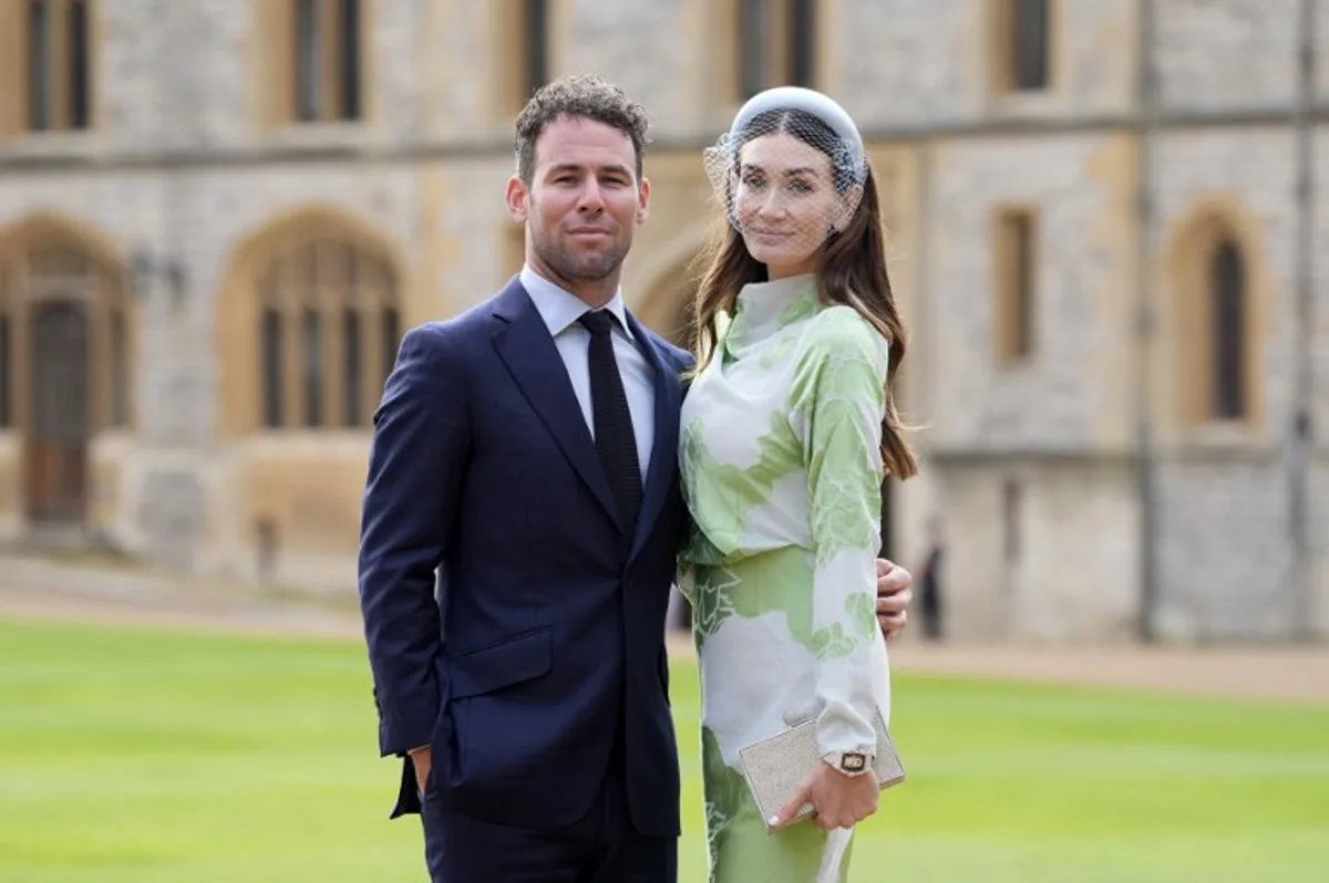 British cyclist Mark Cavendish poses with his wife Peta before being appointed a Knight Commander of the British Empire (KBE) during an investiture ceremony at Windsor Castle, west of London, on October 2, 2024.  Andrew Matthews / POOL / AFP