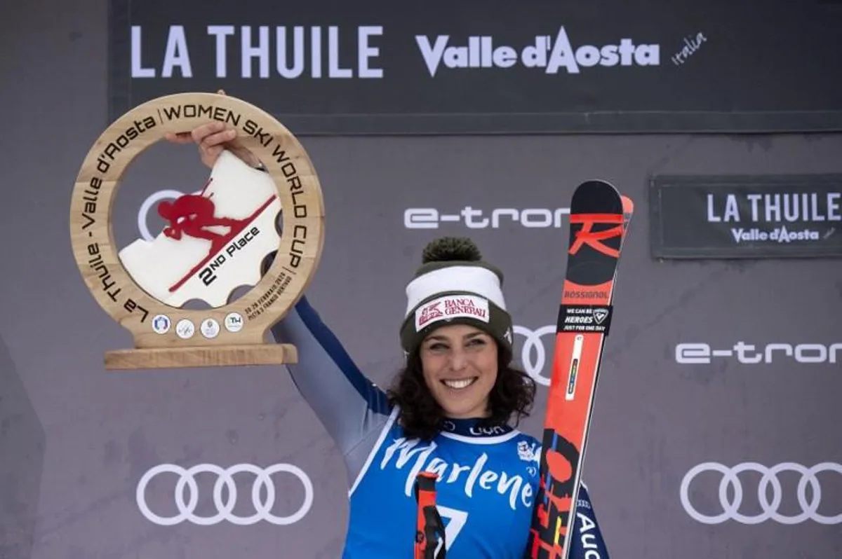 Second Placed Italy's Federica Brignone celebrates during the podium ceremony of the FIS Alpine Skiing World Cup Women's Super G on February 29, 2020 in La Thuile, northern Italy.   MARCO BERTORELLO / AFP