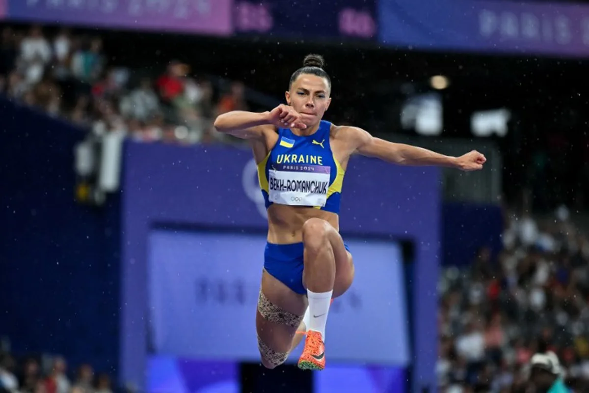 Ukraine's Maryna Bekh-Romanchuk competes in the women's triple jump final of the athletics event at the Paris 2024 Olympic Games at Stade de France in Saint-Denis, north of Paris, on August 3, 2024. Andrej ISAKOVIC / AFP