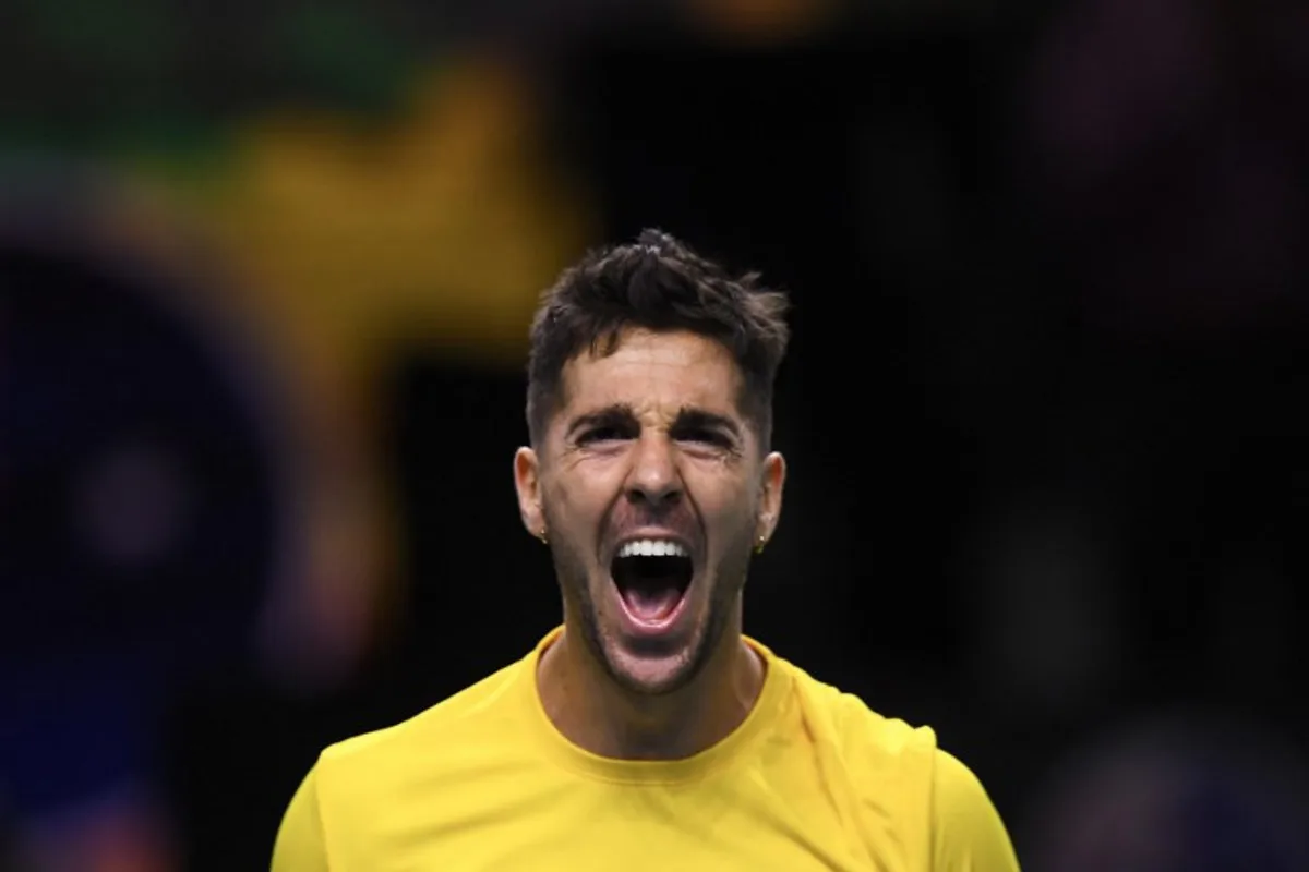 Thanasi Kokkinakis of Team Australia reacts after winning his match against Ben Shelton of Team USA during their quarter-final singles match between USA and Australia at the Davis Cup Finals at the Palacio de Deportes Jose Maria Martin Carpena arena in Malaga, southern Spain, on November 21, 2024.  Jorge GUERRERO / AFP