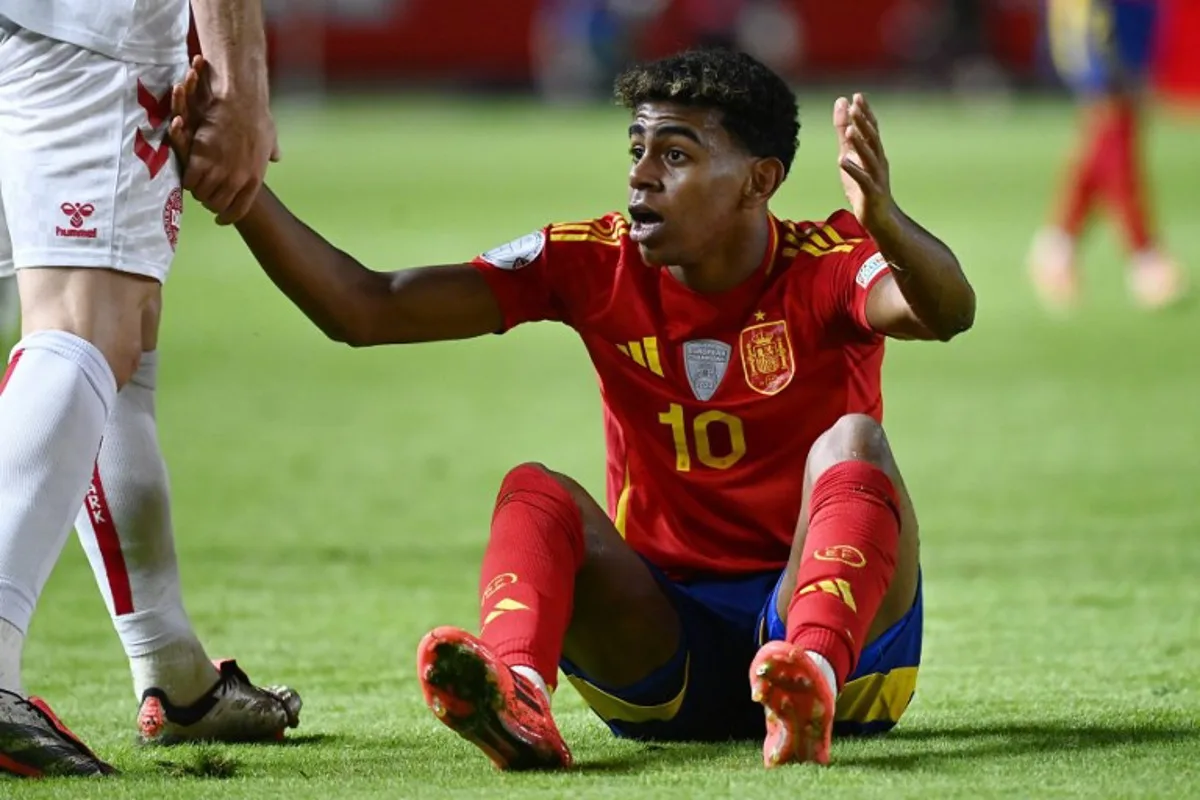 Spain's forward #10 Lamine Yamal reacts during the UEFA Nations League, league A group 4 football match between Spain and Denmark at Nueva Condomina stadium in Murcia, on October 12, 2024.  JOSE JORDAN / AFP