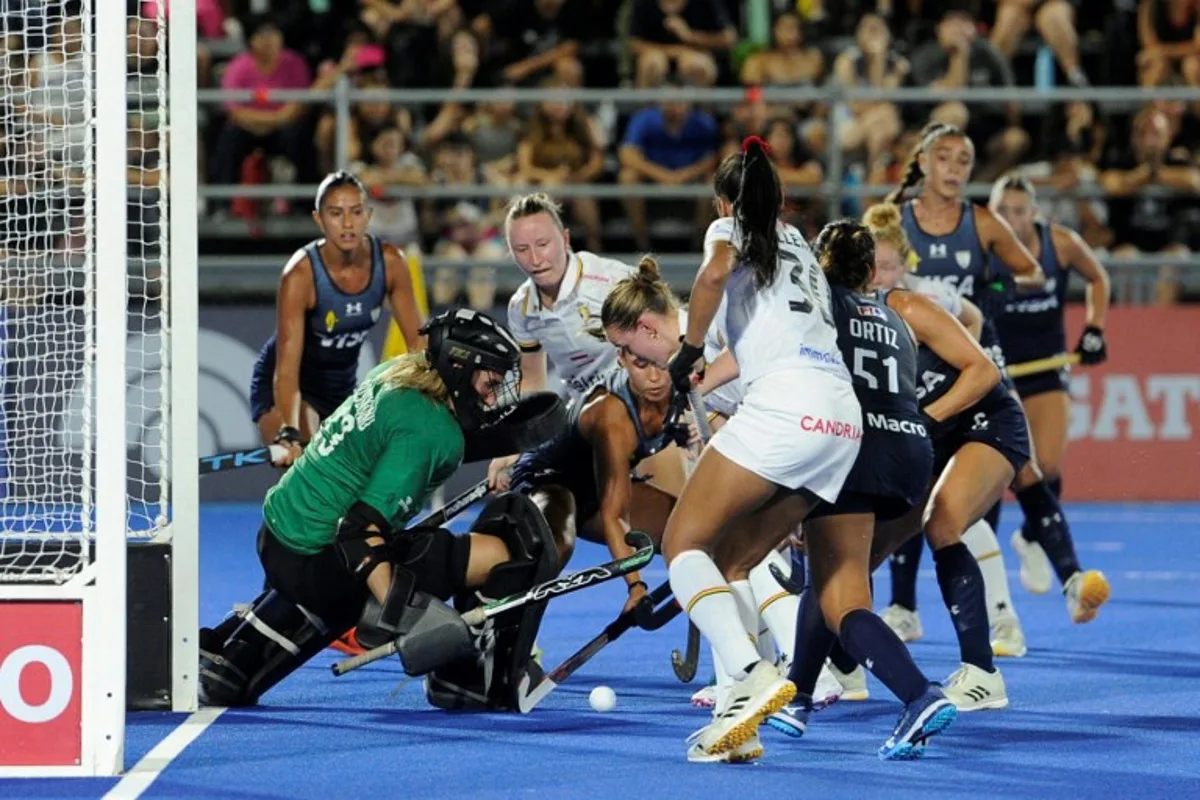 Belgium's goalkeeper Maite Bussels eyes the ball close to players during during their FIH Pro League hockey match in Santiago del Estero, Argentina on February 19, 2025  Eduardo RAPETTI / AFP