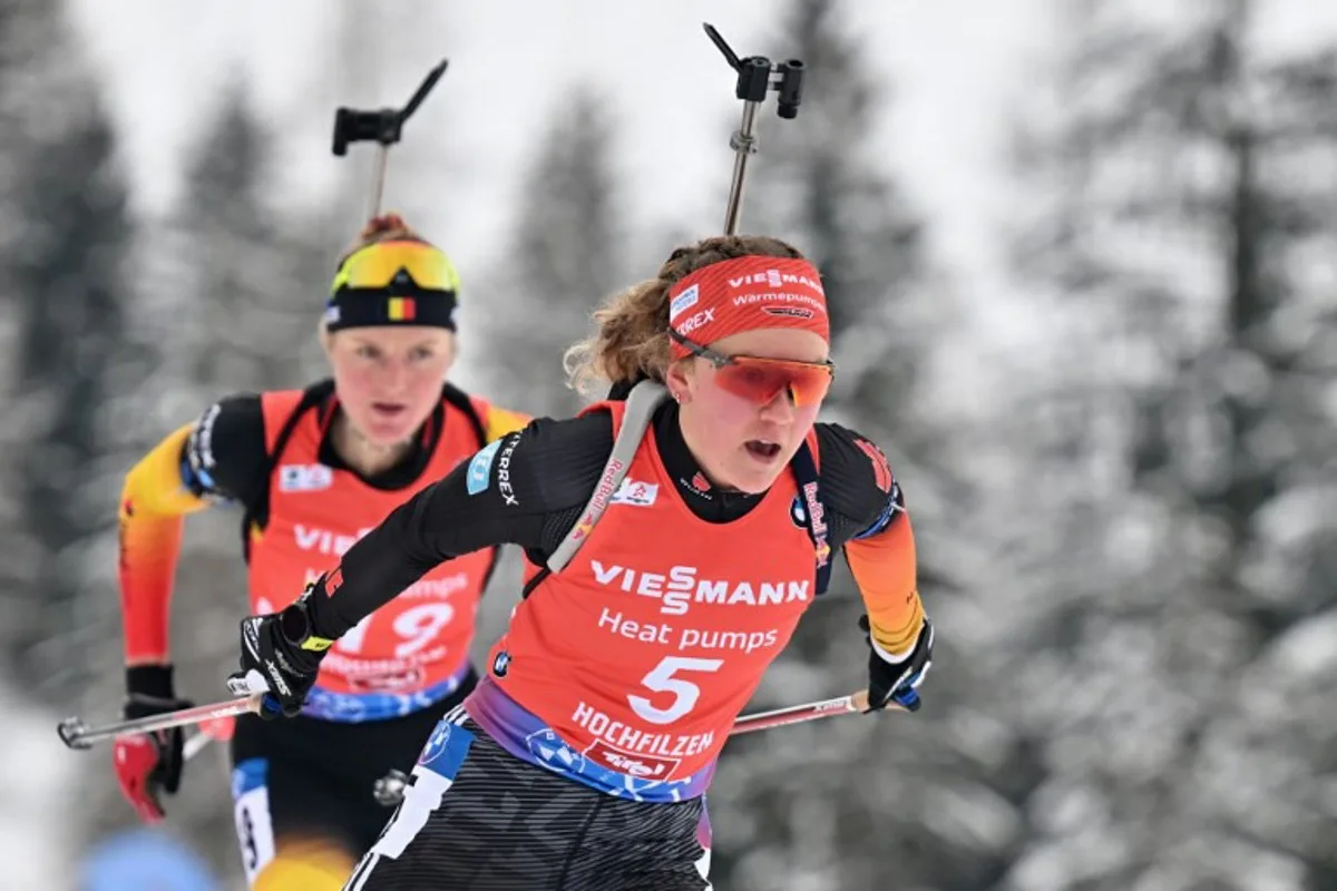 Germany's Selina Grotian competes ahead of Belgium's Maya Cloetens during the women's 10 km pursuit event of the IBU Biathlon World Cup in Hochfilzen, Austria on December 14, 2024.  KERSTIN JOENSSON / AFP