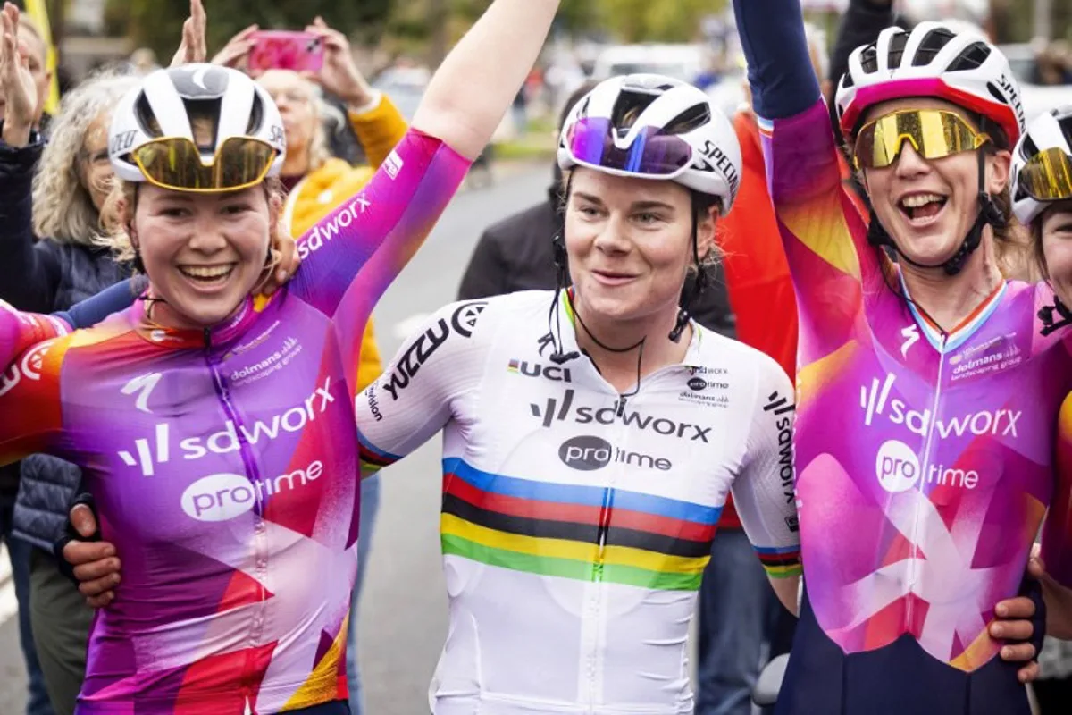 Team SD Worx's Belgian rider Lotte Kopecky celebrates winning the 6th and final stage of the Simac Ladies Tour cycling race, in Arnhem on October 13, 2024.   Iris van den Broek / ANP / AFP