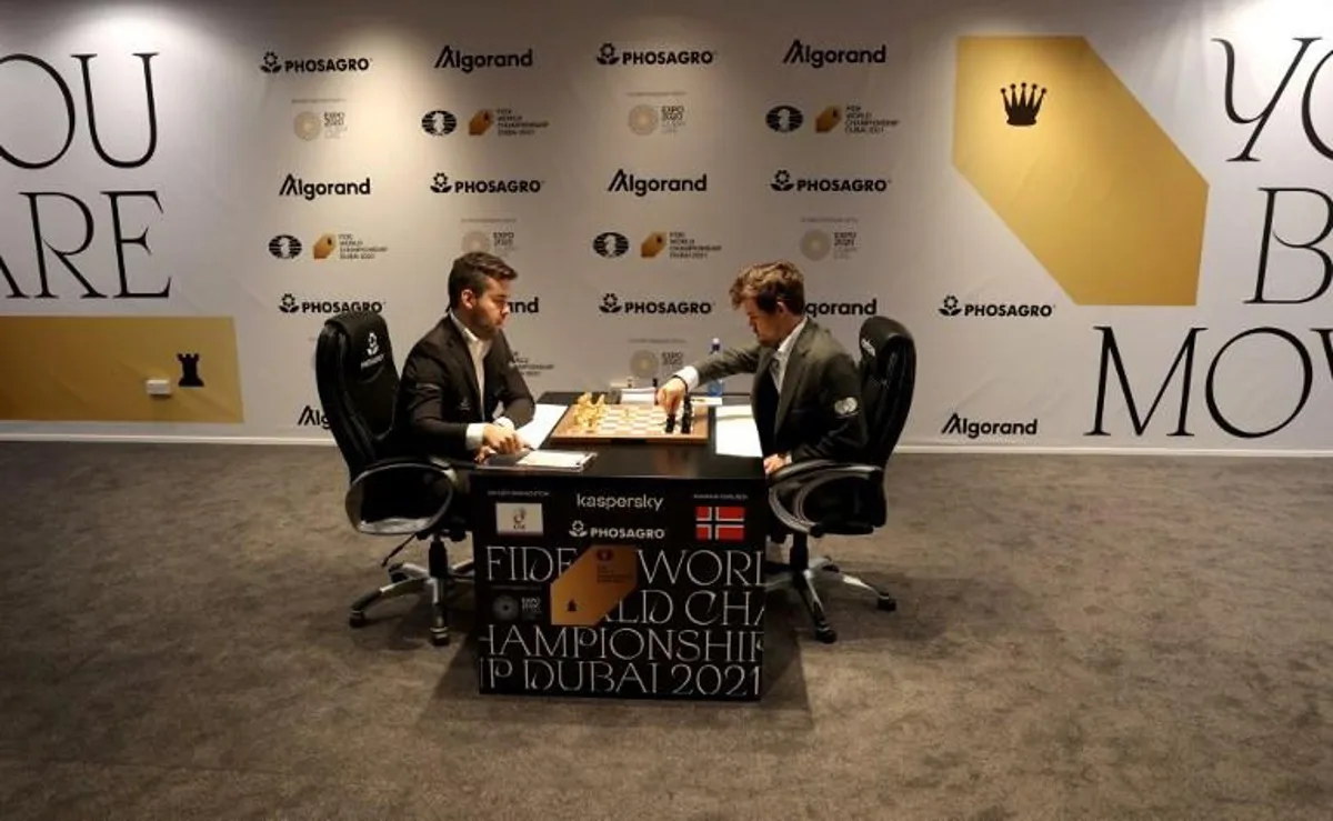 Russia's grandmaster Ian Nepomniachtchi (L) and Norway's grandmaster Magnus Carlsen compete during game 11 in the FIDE World Chess Championship Dubai 2021, at the Dubai Expo 2020 in the Gulf emirate, on December 10, 2021.  AFP