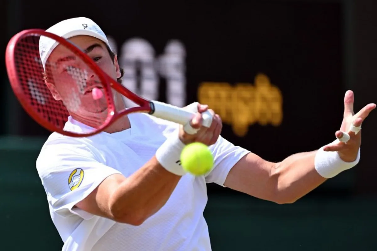 Brazil's Joao Fonseca returns to Russia's Roman Safiullin during their men's singles third round tennis match on the fifth day of the 2026 Wimbledon Championships at The All England Lawn Tennis and Croquet Club in Wimbledon, southwest London, on July 3, 2026. Kirill KUDRYAVTSEV / AFP