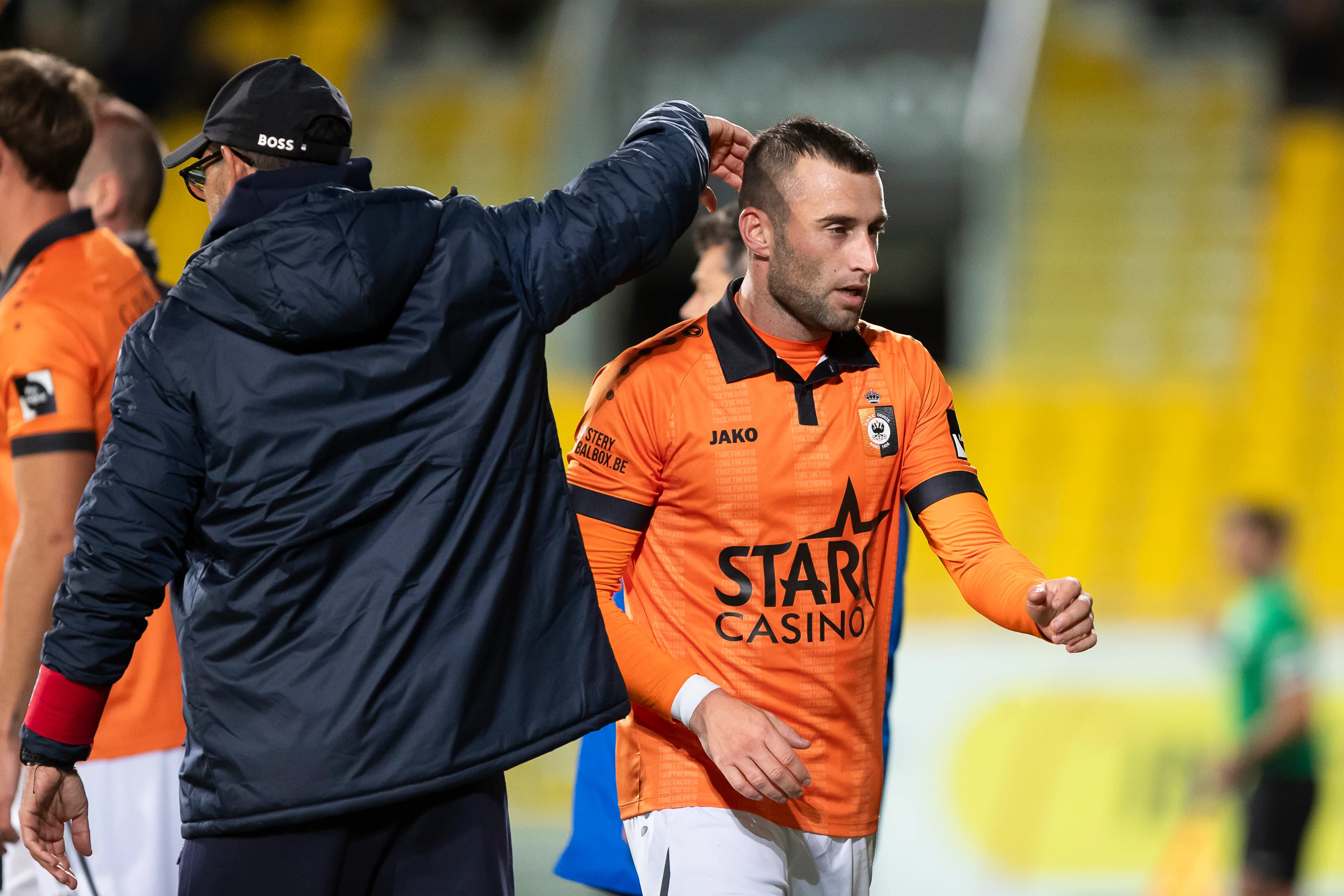 Deinze's head coach Hernan Losada and Deinze's Tuur Dierckx pictured during a soccer match between Lokeren-Temse and KMSK Deinze, in Lokeren, on day 6 of the 2024-2025 season of the 'Challenger Pro League' second division of the Belgian championship, Saturday 28 September 2024. BELGA PHOTO KRISTOF VAN ACCOM