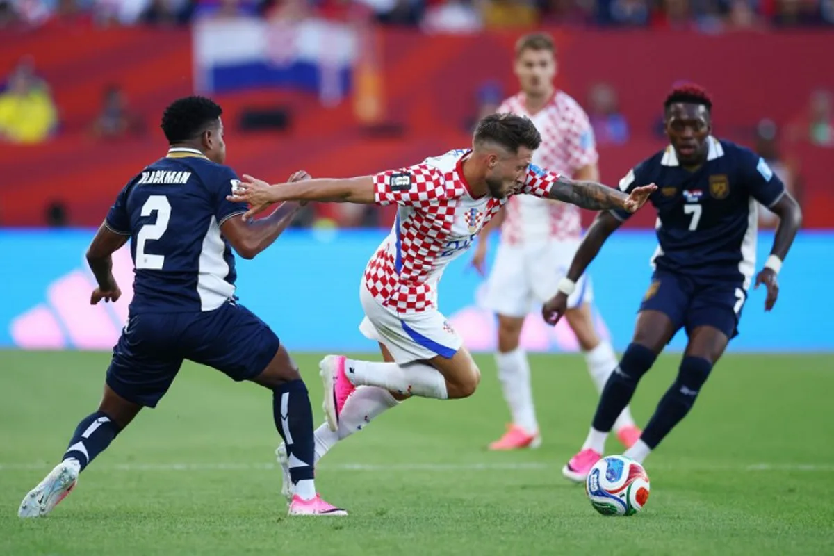 Croatia's forward #24 Marco Pasalic is fouled by Panama's defender #02 Cesar Blackman during the 2026 World Cup Group L football match between Panama and Croatia at the Toronto Stadium in Toronto on June 23, 2026. Cole Burston / AFP