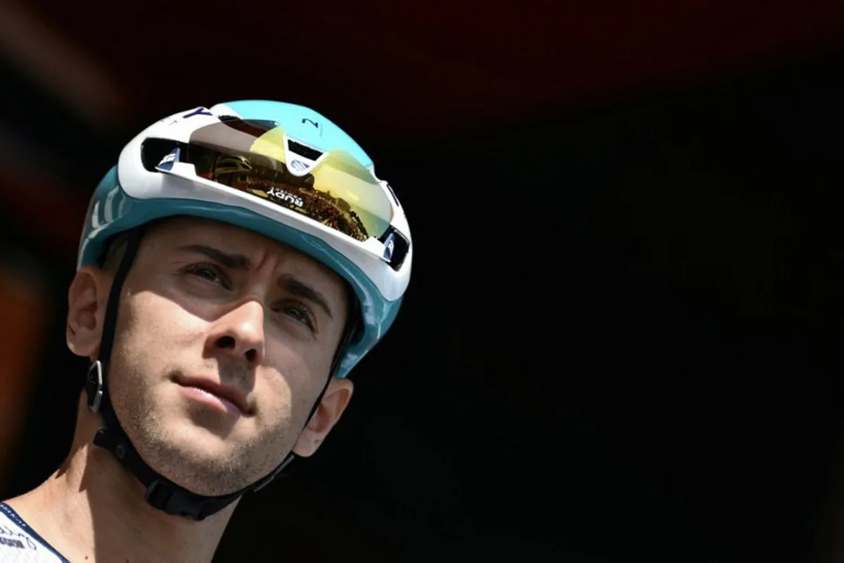 Team Bahrain's Italian rider Antonio Tiberi is presented on stage before the start of the Vuelta a Espana, a 183 km race between Torino - Reggia di Venaria and Novara, in Italy's Piemonte region, on August 23, 2025. Marco BERTORELLO / AFP